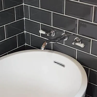 white sink black tiles