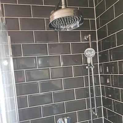 shower with black tiles